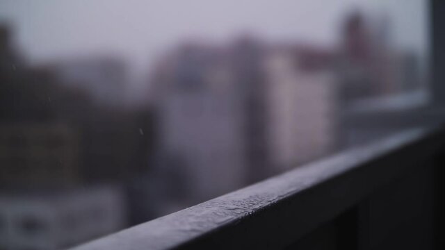 raindrops dripping onto the metal fence