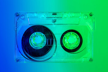Plastic transparent cassette tape - blue and green background, pop art style