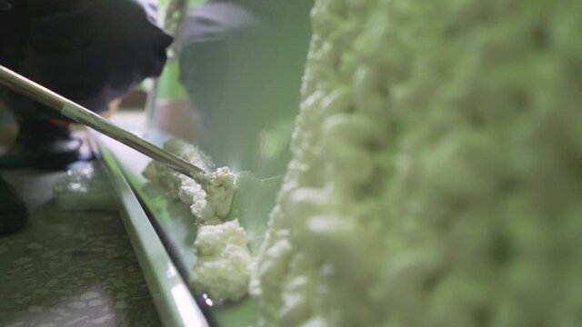Foaming the bathtub with polyurethane foam. Texture of white foam. Airy white foam.