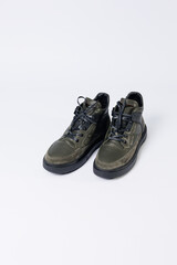 Leather short men's boots on a white background. Winter boots collection 2022.