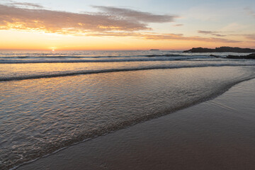 Sweet golden sunset in Praia Grande de Porto Covo. Alentejo