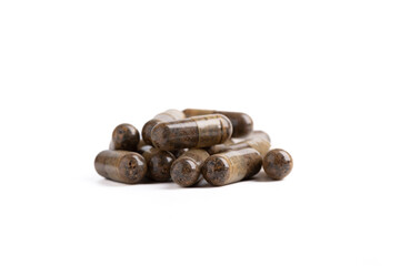 Capsules with nutritional supplements and vitamins on a white background, the back capsules are blurred.