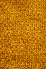 Knitted yellow texture. Knitted background.