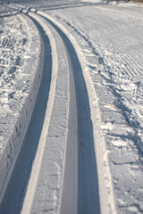 Fototapeta na wymiar cross-country ski trail track in the snow