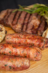 Grilled with rib of beef, chistorra and sausages. Golden sausages ready for the celebration of the picnic. Charcoal grill concept. Amatlan, Mexico