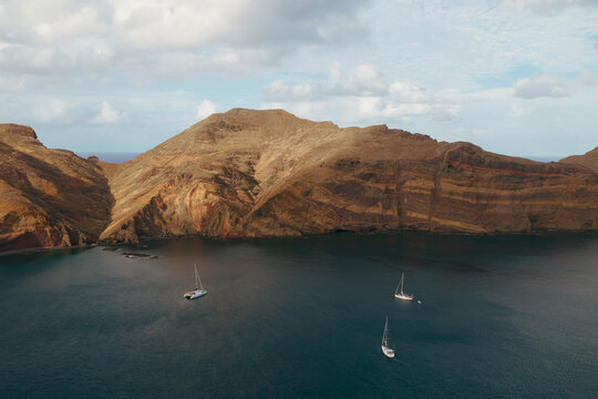 Sao Lorenco Peninsula, Madeira, Portugal. Rocky ocean coast and three boats. 