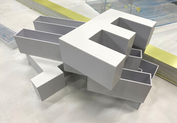 White three-dimensional letters made of plastic. Production 
 the text of the outdoor advertising inscription for the store.