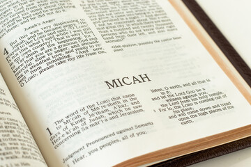 Micah open Holy Bible Book close-up. Old Testament Scripture prophecy. Studying the Word of God Jesus Christ. Christian biblical concept of faith and trust.