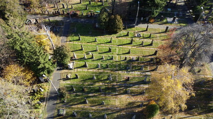 Arial drone view flight over old cemetery with tombstones, gravestones and arrows. Drone point of...