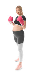 Fototapeta premium Young pregnant woman in boxing gloves on white background