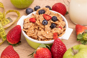 cereal bowl top view with measuring tape, health and diet concept