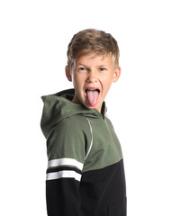 Angry little boy in hoodie showing tongue on white background