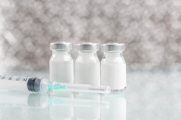 Vaccine bottle with blank white label.Vaccination, immunization, treatment to provides active acquired immunity to a particular infectious disease. Healthcare And Medical concept.