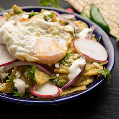 Mexican green chilaquiles with fried egg and cheese