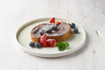 Crack Pie, American dessert with a rich salty-sweet taste on an oatmeal basis, on a table.