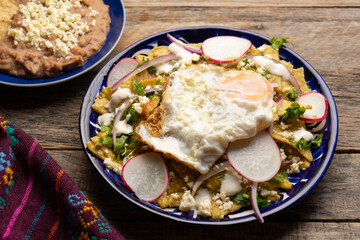 Mexican green chilaquiles with fried egg and cheese