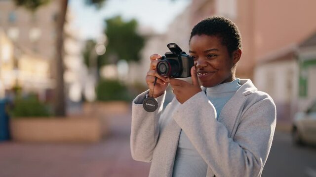 African american couple make picture using professional camera at street