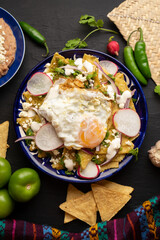 Mexican green chilaquiles with fried egg and cheese