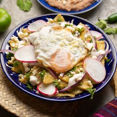 Mexican green chilaquiles with fried egg and cheese