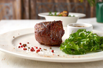 Filet mignon served on a plate in restaurant