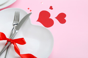 Beautiful table setting for Valentine's Day on pink background