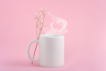 Fototapeta na wymiar Mockup white coffe cup or mug on a pink background. Hot drink steam in the form of heart