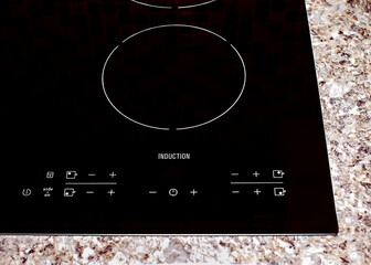 The control panel of the induction cooker is photographed in close-up. Built-in household appliances. The induction hob.