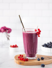 Healthy blueberry smoothie with red currants