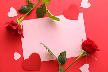 Composition with blank card, rose flowers and paper hearts, closeup. Valentine's Day celebration