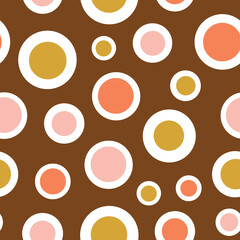 Abstract geometric circle seamless pattern. Pink and yellow circles on brown background.