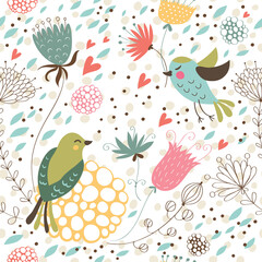 Seamless background with flowers, hearts and birds.
