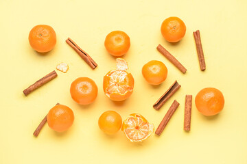 Tasty tangerines on yellow background