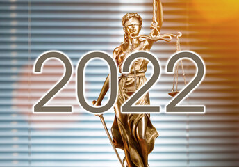 Statue of lady justice on bright background - Side view with copy space. year 2022 change of law