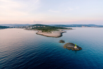 Lighthouse on an island opposite Punta Planca cape. Aerial view