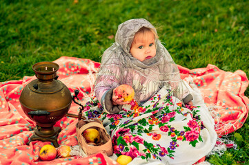 little girl in a Russian costume. Little girl in traditional Russian folk costume. Russian children. . High quality photo