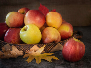 Naklejka na ściany i meble Basket with fresh apple on the kitchen counter