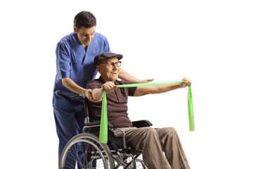 Helathcare worker helping an elderly man in a wheelchair exercising with a stretch band