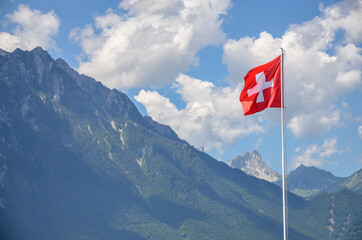 swiss flag in the mountains