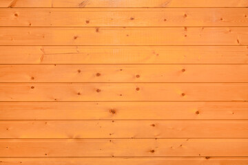 Bright orange or brown wooden texture of the interior of the background board