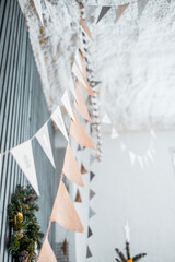 Christmas decor for home with garlands of flags. Soft focus