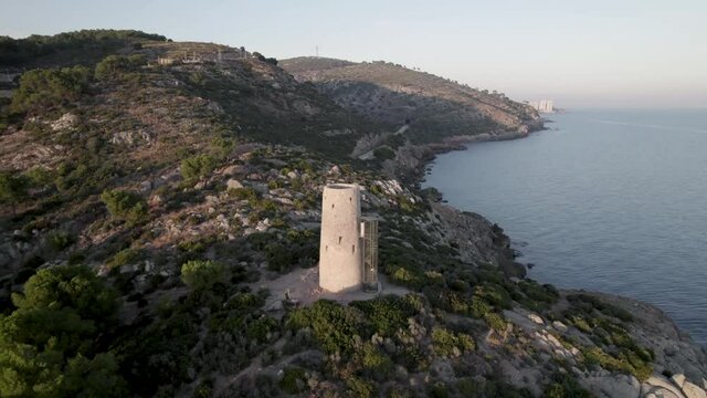 Orbital 4K footage around medieval defensive coast tower Torre de la Corda in Oropesa del Mar, Castell&oacute;n, Spain