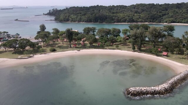 Aerial View Of Pristine Lagoon In Kusu Island, One Of The Southern Islands In Singapore. drone tilt down approach