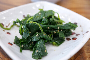 Korean-style side dish made with seasoned spinach that has been soaked in boiling water