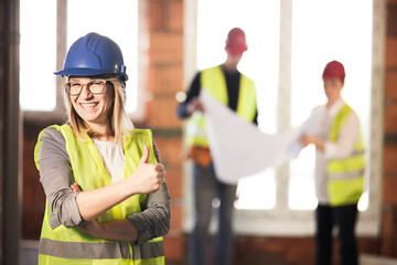 worker, investor, inspector or architect showing thumbs up. construction site engineers on site. happy expression