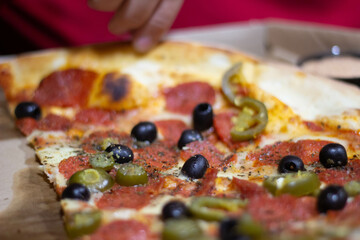 Friends eats a delicious pizza