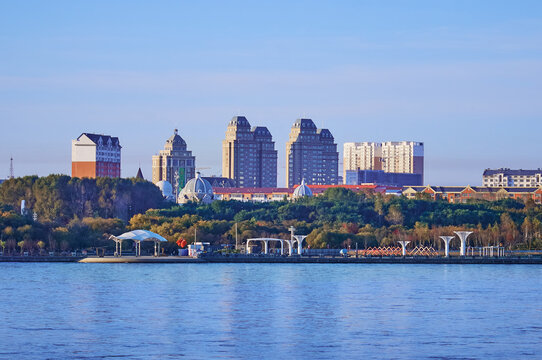 Russian-Chinese border along the Amur River. View from the embankment of the city of Blagoveshchensk, Russia to the city of Heihe, China. A mixture of architectural styles.