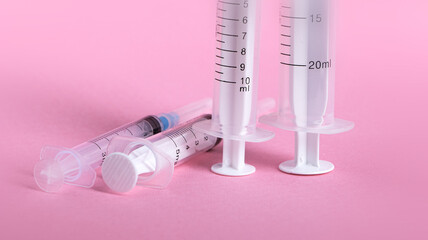 Close up of medical tablets and pills and drugs and syringes