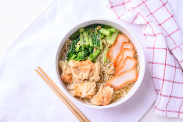 Noodles soup with wonton dumpling and grilled red pork, Asian food, Top view