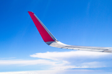 Red Winglet airplane detail on flight, from window view