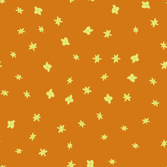 Seamless pattern with flowers. Abstract cute pattern with green flowers on a brown background. Random, chaotic pastel background with daisies.